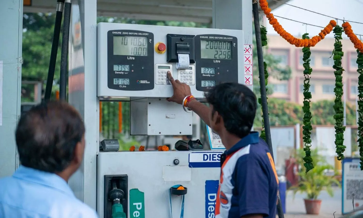 Petrol Pump Staff Assisting a Visitor stock photo Petrol Pump Staff Assisting a Visitor stock photo