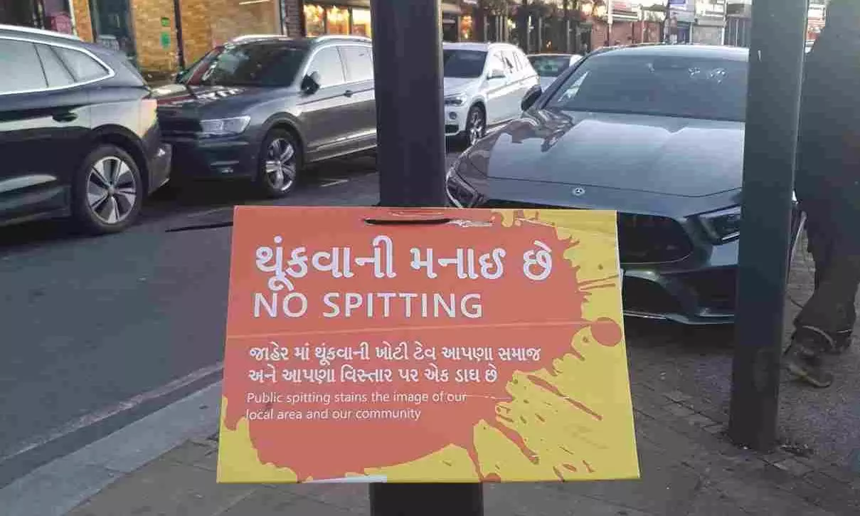 A No Spitting poster on a pole on the high street in Kingsbury, North West London – an area which has a large Gujarati population. A No Spitting poster on a pole on the high street in Kingsbury, North West London – an area which has a large Gujarati population.