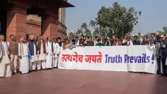 Opposition MPs stage a protest during Parliament Winter session