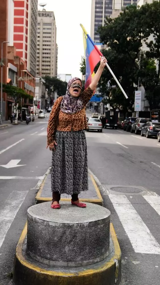 A supporter of Venezuelan President Nicolas Maduro A supporter of Venezuelan President Nicolas Maduro