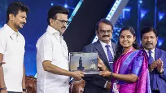 TN CM Stalin handing over free laptop to college student