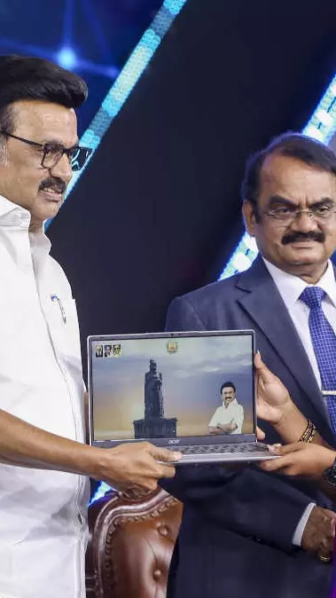 TN CM Stalin handing over free laptop to college student
