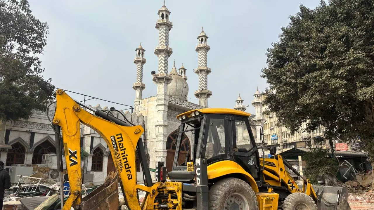 A bulldozer stands next to Faiz-e-Elahi Masjid in Old Delhi. A bulldozer stands next to Faiz-e-Elahi Masjid in Old Delhi.