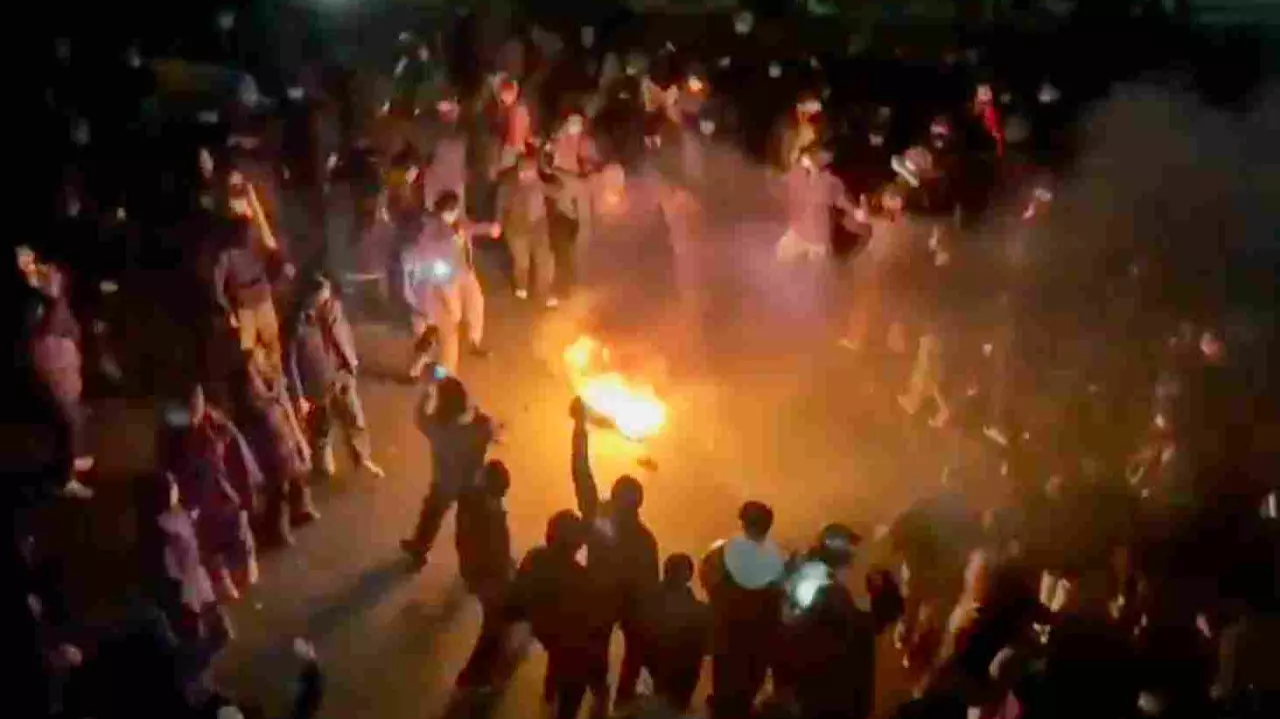 n this frame grab from footage circulating on social media shows protesters dancing and cheering around a bonfire as they take to the streets despite an intensifying crackdown as the Islamic Republic remains cut off from the rest of the world, in Tehran, Iran, Friday, Jan. 9, 2026.AP/PTI