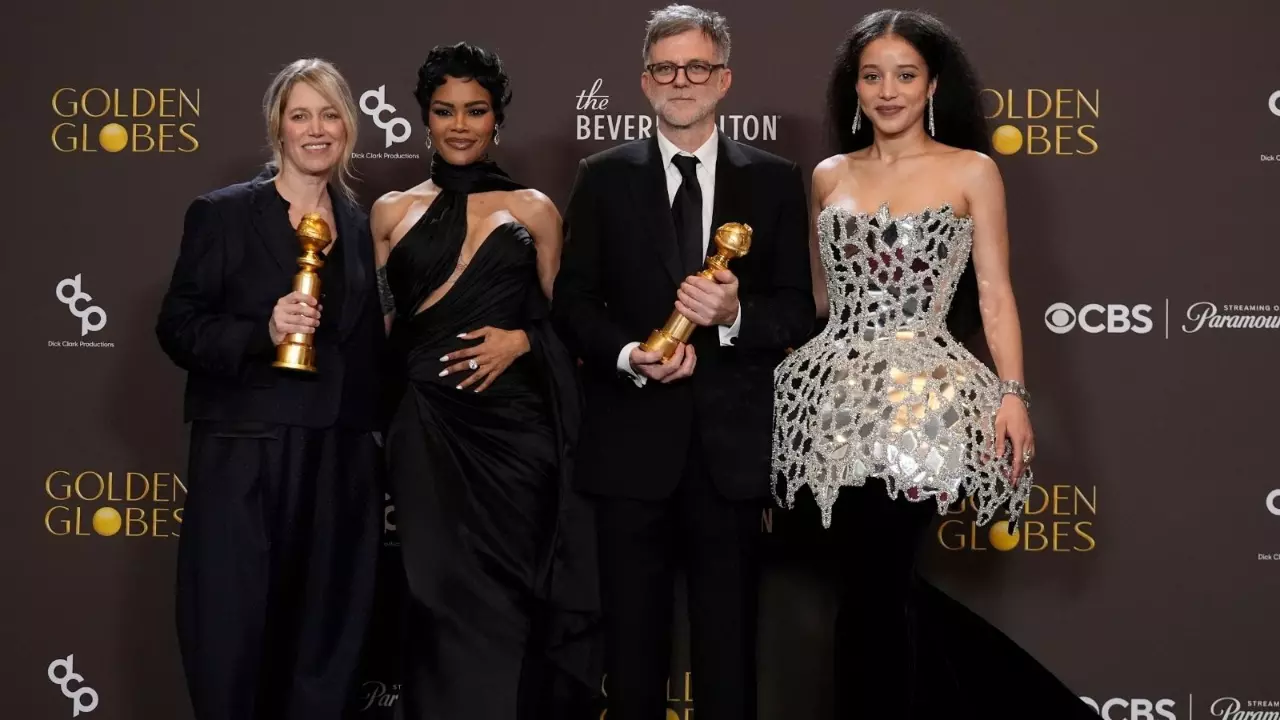 (From left to right) Sara Murphy, Teyana Taylor, Paul Thomas Anderson, and Chase Infiniti pose in the press room with the award for best motion picture - musical or comedy for One Battle After Another during the 83rd Golden Globes