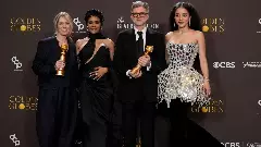 (From left to right) Sara Murphy, Teyana Taylor, Paul Thomas Anderson, and Chase Infiniti pose in the press room with the award for best motion picture - musical or comedy for One Battle After Another during the 83rd Golden Globes