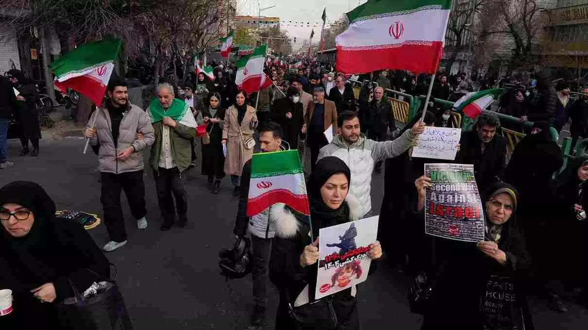 People carry Iranian flags and pro-government placards during a funeral ceremony for a group of security forces, who were killed during anti-government protests in Iran People carry Iranian flags and pro-government placards during a funeral ceremony for a group of security forces, who were killed during anti-government protests in Iran