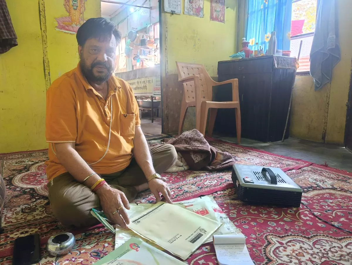 Ashok Raina at his residence at the Purkhoo camp. Photo: Basharat Amin