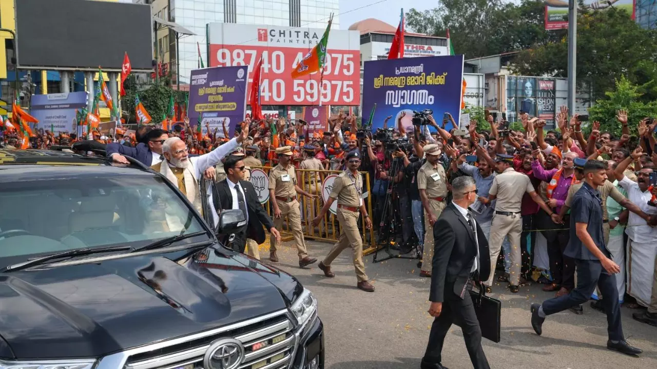 Prime Minister Narendra Modi greets people in Thiruvananthapuram