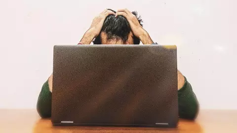 Stressed and Anxious Young men Looking at Laptop Screen Stressed and Anxious Young men Looking at Laptop Screen