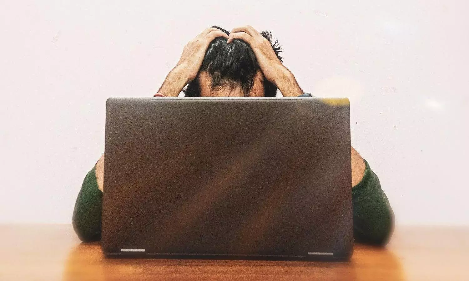 Stressed and Anxious Young men Looking at Laptop Screen Stressed and Anxious Young men Looking at Laptop Screen