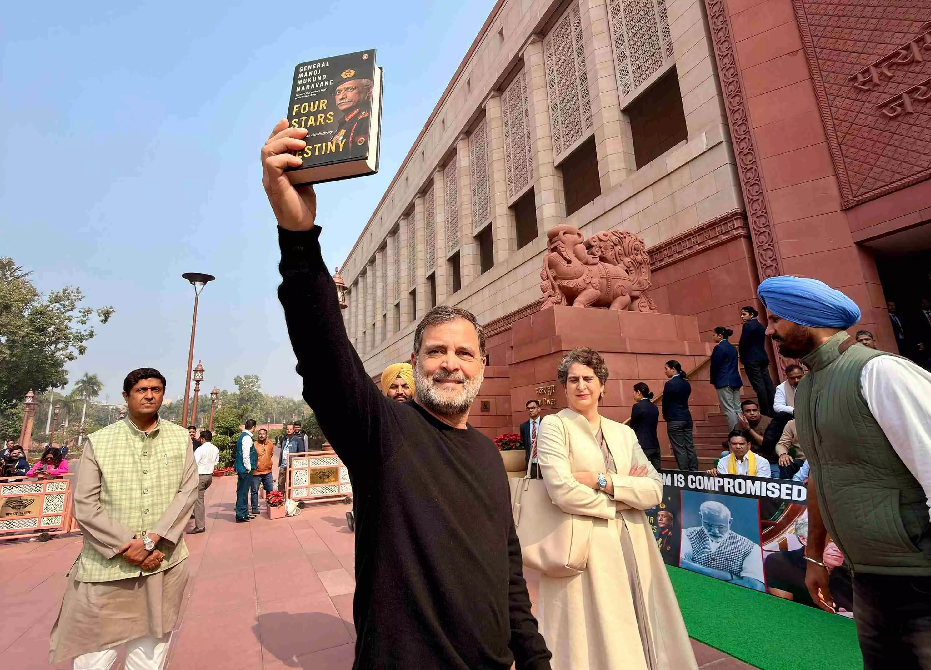 Leader of Opposition Rahul Gandhi displays former Army chief MM Naravanes unpublished memoir in Parliament premises.