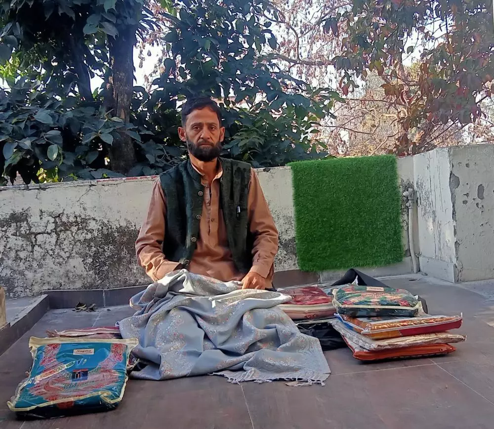 A trader displays his wares. Photo: By special arrangement