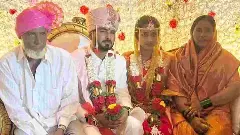 Muslim parents with their adopted Hindu son at his wedding ceremony