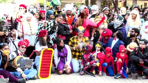 Fans in colorful cosplay costumes gather at Comic Con 2026 in Chennai, posing and interacting at the pop culture festival.