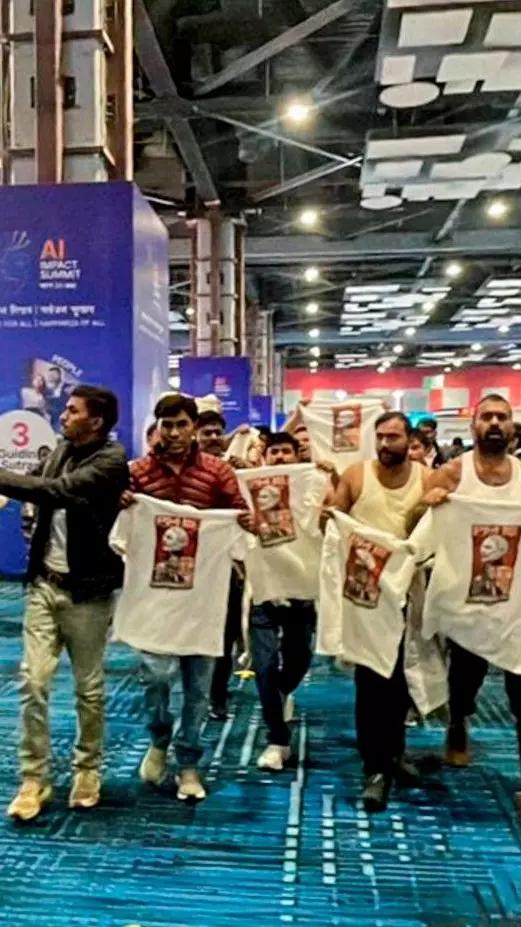 Indian Youth Congress (IYC) workers stage a shirtless protest