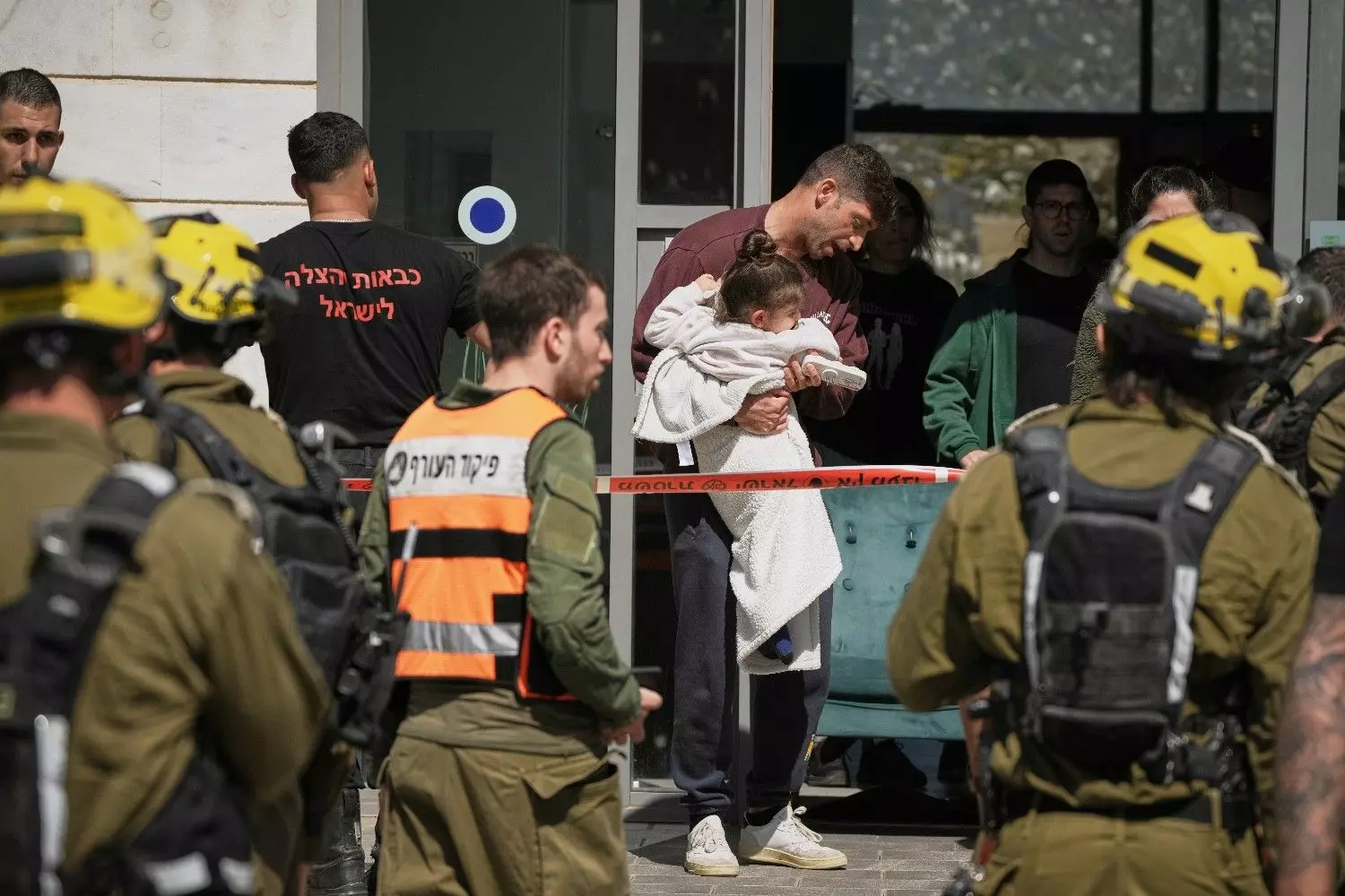 Residents evacuate a building hit by a projectile in Tirat Hacarmel, northern Israel, Saturday, February 28. No injuries were reported. AP/PTI Residents evacuate a building hit by a projectile in Tirat Hacarmel, northern Israel, Saturday, February 28. No injuries were reported. AP/PTI