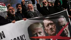 People chant slogans as they protest against US and Israeli strikes