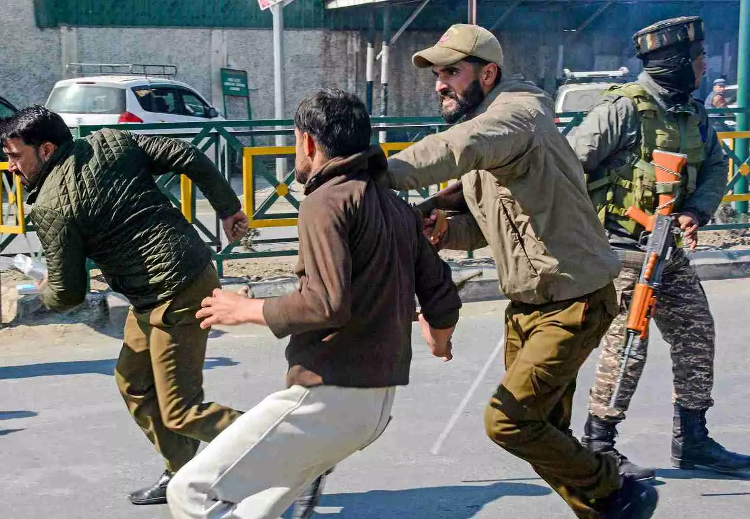 Police stop people during a protest over the killing of Irans Supreme Leader Ayatollah Ali Khamenei, amid severe restrictions on the movement of people in parts of Kashmir, in Srinagar, Monday. PTI Photo Police stop people during a protest over the killing of Irans Supreme Leader Ayatollah Ali Khamenei, amid severe restrictions on the movement of people in parts of Kashmir, in Srinagar, Monday. PTI Photo