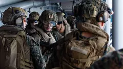 US Sailors and Marines aboard USS Tripoli