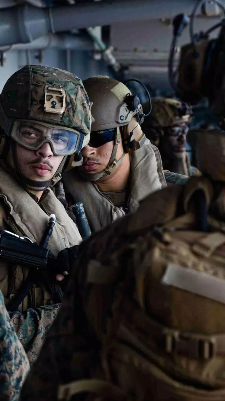 US Sailors and Marines aboard USS Tripoli