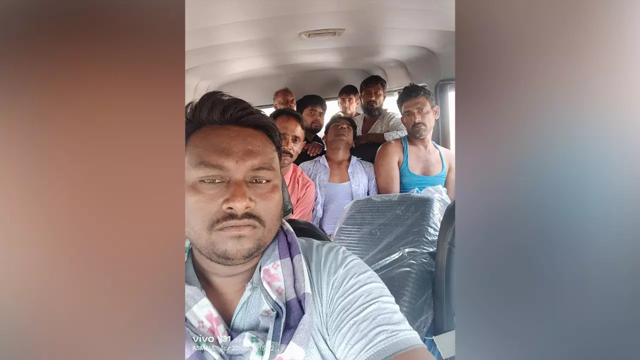 Samayun Sheikh (front) and other migrant workers from West Bengal who hired an SUV to return home in Murshidabad district from neighbouring Odisha to cast votes in the April 23 elections.