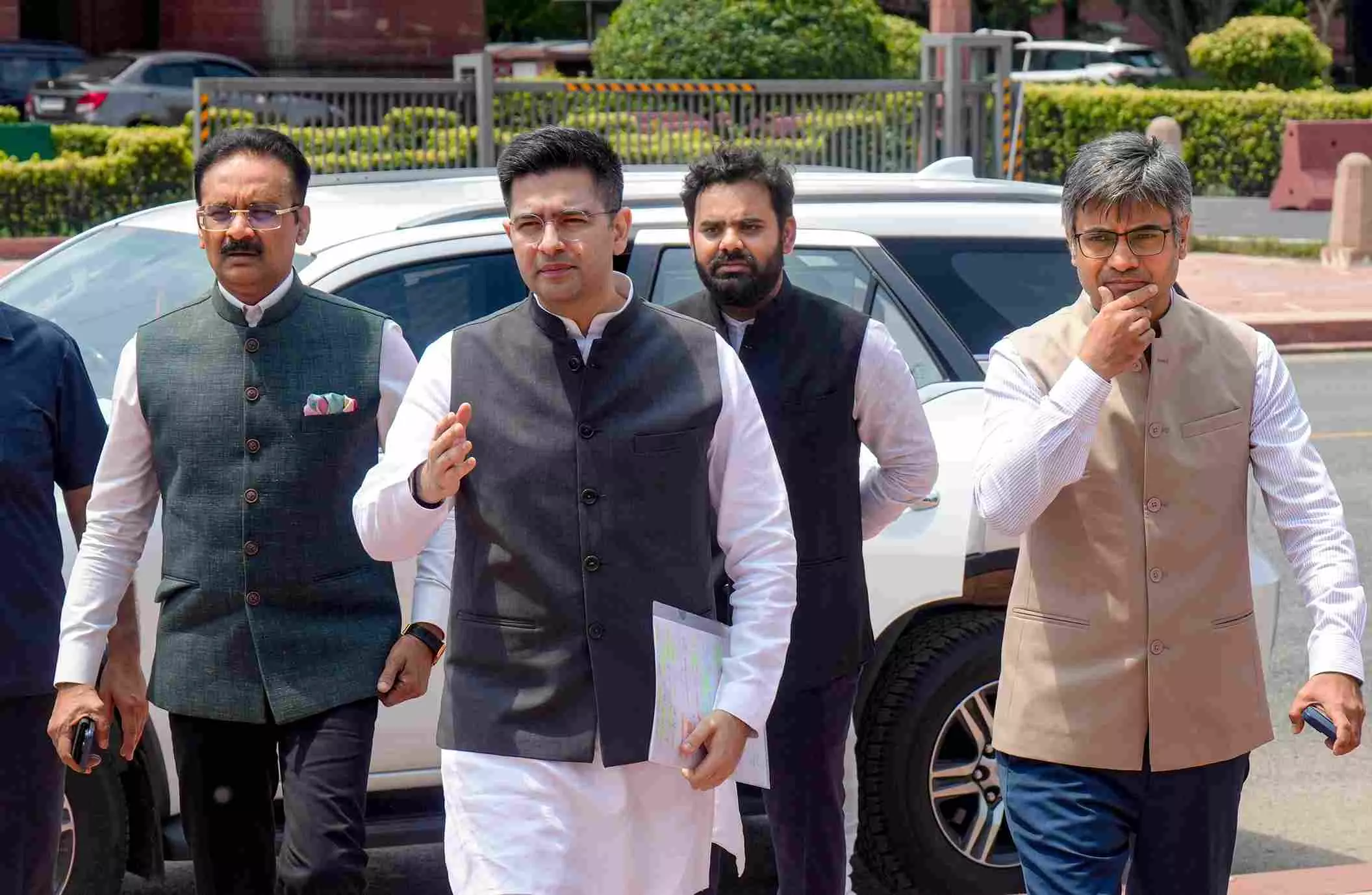 Raghav Chadha and Sandeep Pathak with others. PTI file photo