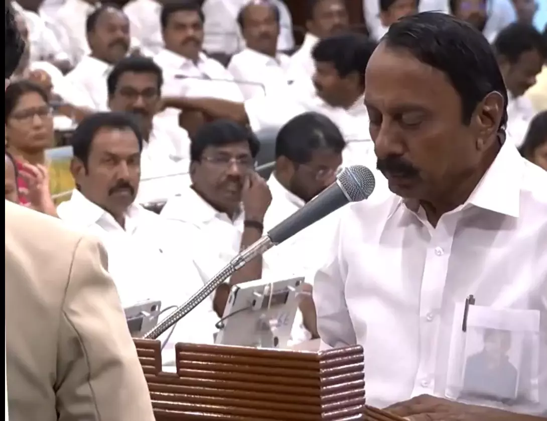 TVK leader K A Sengottaiyan takes oath as an MLA carrying a photo of former Chief Minister J Jayalalithaa in his shirt pocket. Photo: Screengrab/PTTOnline