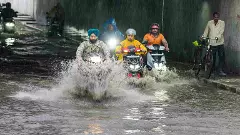 Delhi rain: IMD issues red alert as heavy showers trigger waterlogging, traffic chaos