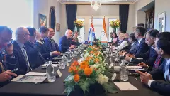 New Zealand PM Christopher Luxon (left), PM Narendra Modi, and others