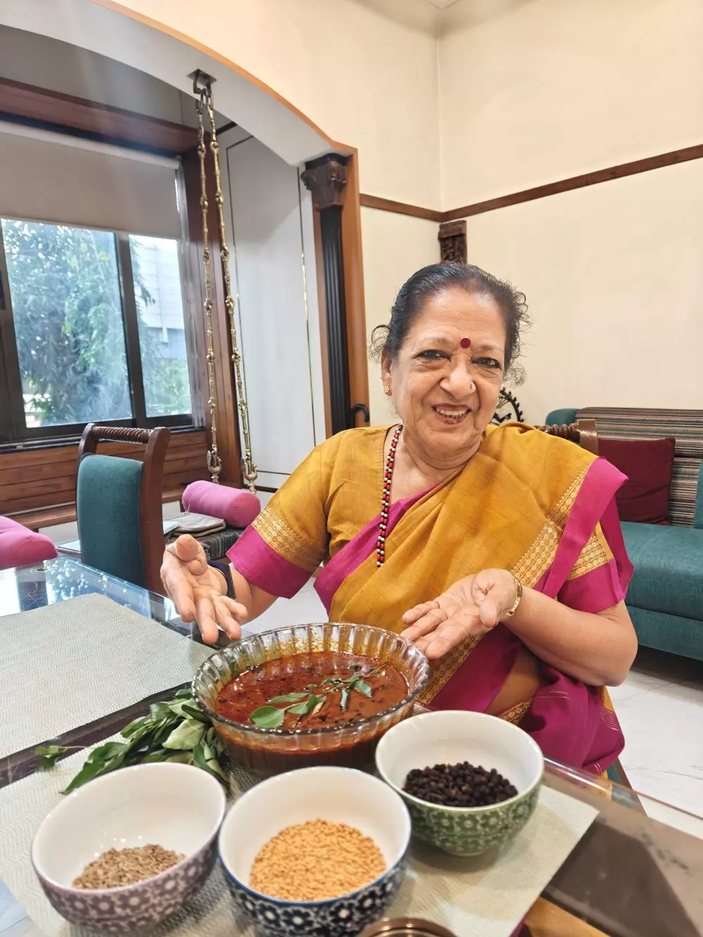 Kala Ramnathan with a bowl of kumbakonam milagu kuzhambu, the first dish she had learnt to make after she got married in the sixties. Photo: By special arrangement