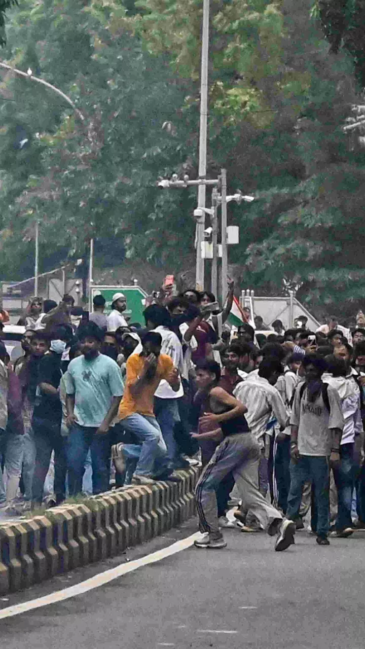 Protesters gather amid tear gas smoke during the demonstration