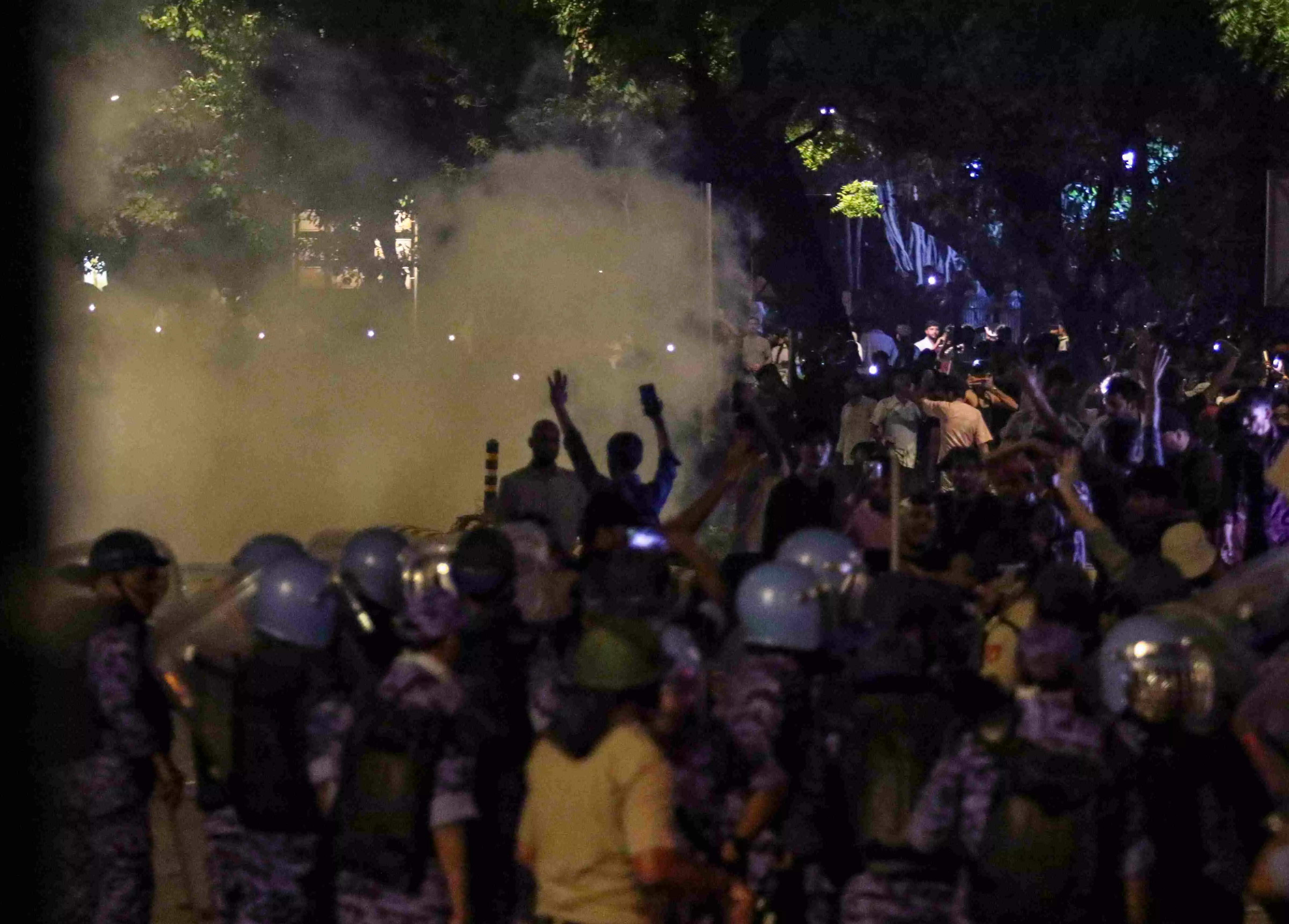 Security officials use tear gas during the ongoing protest over alleged irregularities in the NEET examination, near Jantar Mantar in New Delhi Security officials use tear gas during the ongoing protest over alleged irregularities in the NEET examination, near Jantar Mantar in New Delhi