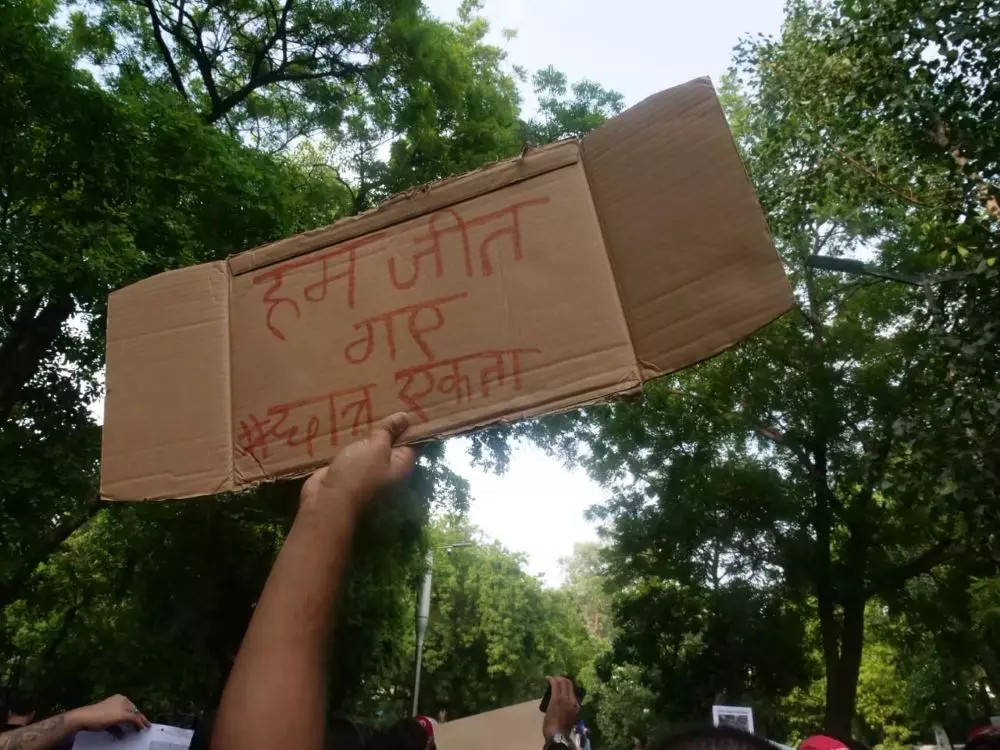United they stood: An agitator holds a placard on the power of students unity. Photo: Eshan Sharma United they stood: An agitator holds a placard on the power of students unity. Photo: Eshan Sharma