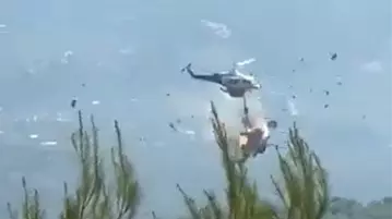 Firefighting helicopters collide near Athens as Europe’s wildfire rages; 2 dead