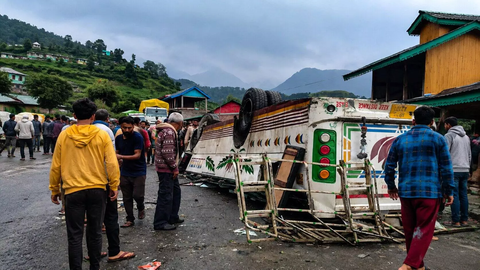 People gather after a private bus overturned and plunged onto a lower road, in Chamba district, Himachal Pradesh People gather after a private bus overturned and plunged onto a lower road, in Chamba district, Himachal Pradesh