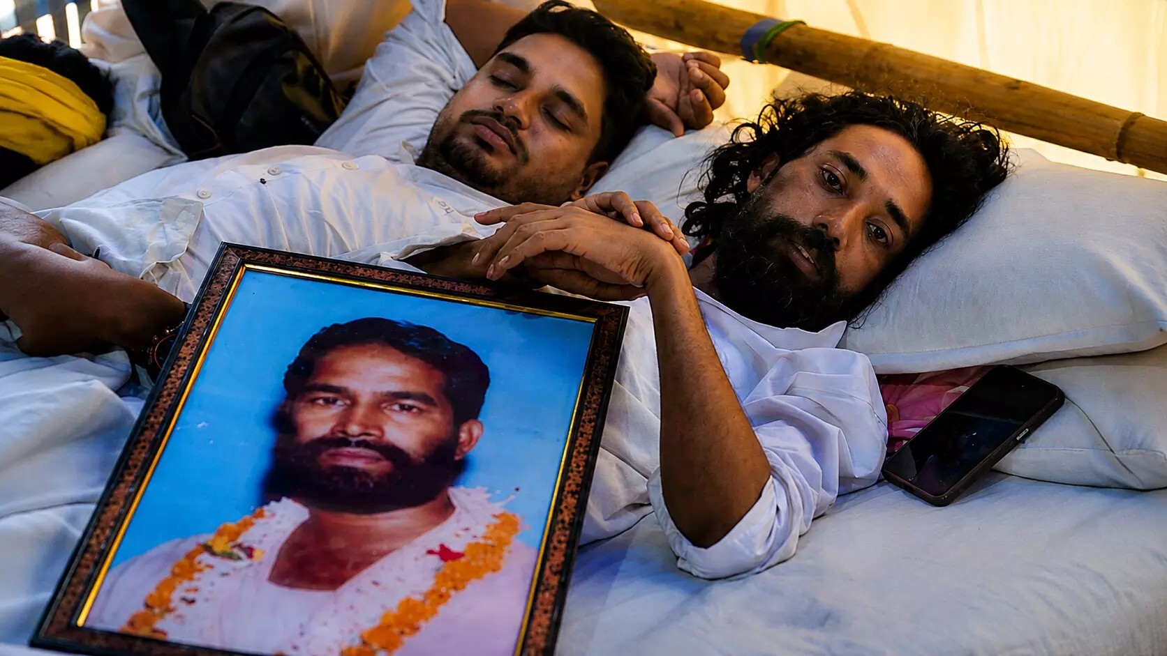 Student leader Devendra Nath Mahto, right, and others during an indefinite hunger strike Student leader Devendra Nath Mahto, right, and others during an indefinite hunger strike