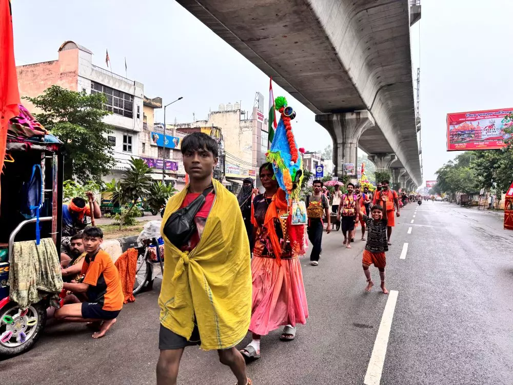 Pilgrims Progress: Kanwariyas carry holy water to offer to the Hindu deity Shiva on Shrawan Shivratri Pilgrims Progress: Kanwariyas carry holy water to offer to the Hindu deity Shiva on Shrawan Shivratri