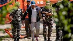 Nepal army personnel amid a rescue and search operation after flash floods, at the Army Training Centre in Nuwakot, Nepal
