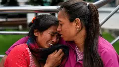 Family members and relatives of missing persons cry in the aftermath of the flash floods in Nepal Family members and relatives of missing persons cry in the aftermath of the flash floods in Nepal
