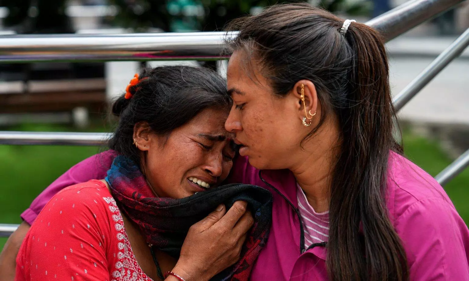 Family members and relatives of missing persons cry in the aftermath of the flash floods in Nepal Family members and relatives of missing persons cry in the aftermath of the flash floods in Nepal