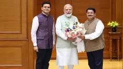 Dhanraj Nathwani (extreme left) with Prime Minister Narendra Modi and Parimal Nathwani