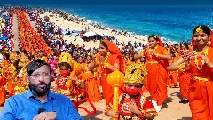 School children in saffron attire and traditional costumes performing during a Ram Yatra event in Dhanushkodi. School children in saffron attire and traditional costumes performing during a Ram Yatra event in Dhanushkodi.