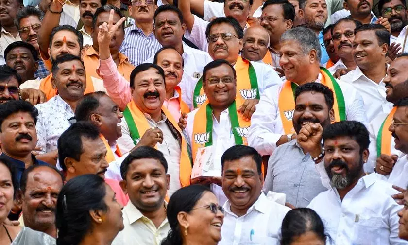 Karnataka BJP members after he partys victory in the three Legislative Council constituencies. Photo: PTI